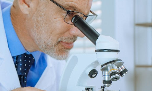 gemologist observing lab diamonds