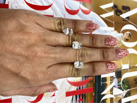 woman showcasing different diamond shapes