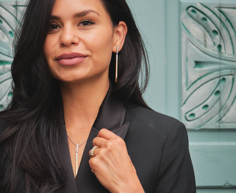 woman wearing a dazzling statement diamond pendant by John Atencio