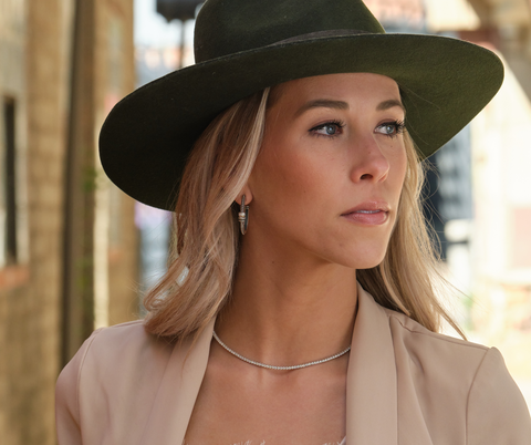 woman wearing a tennis necklace from John Atencio