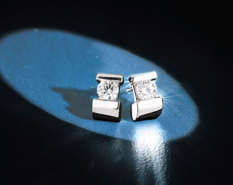 a product image of a pair of diamond stud earrings by John Atencio